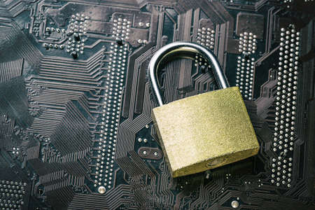 Padlock on computer motherboard. Internet data privacy information security concept.