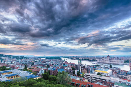 Parliament and riverside in Budapest Hungary with Dramatic sky during sunset.の写真素材