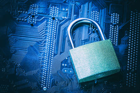 Padlock on computer motherboard. Internet data privacy information security concept.の写真素材