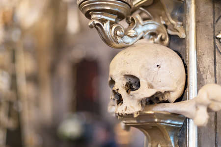 Ancient human skull and bone decoration in Sedlec, Czech republic. Kutna Hora.の写真素材