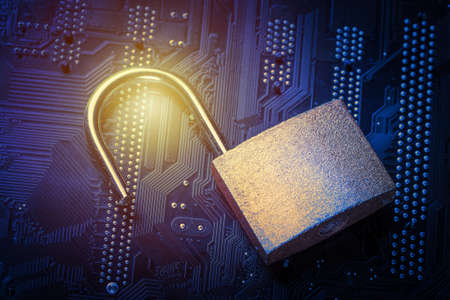 Opened padlock on computer motherboard. Internet data privacy information security concept. Blue...