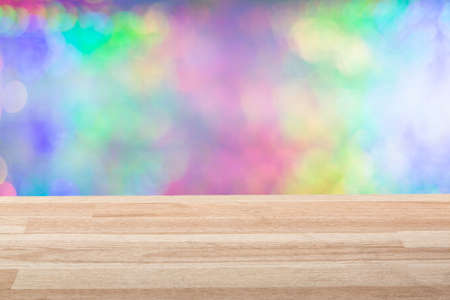 Empty light wood table top with colorful background. Can be used for new year, christmas or any holiday event projectの写真素材