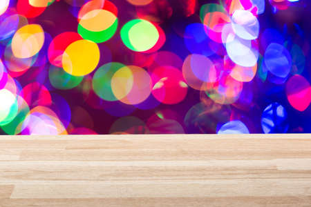 Empty light wood table top with colorful background. Can be used for new year, christmas or any holiday event project or template.の写真素材