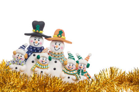 Christmas gold spangle with snowman family decoration isolated on white background.の写真素材