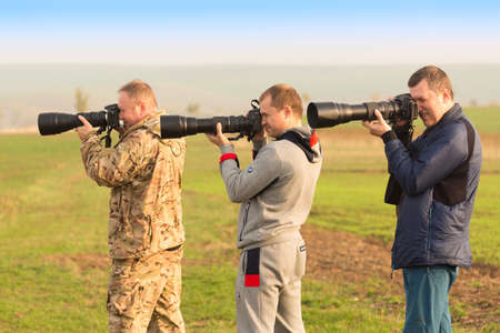 KYJOV, CZECH REPUBLIC - OCTOBER, 2017: Photographers group make photos of amazing South Moravian Fields in Czech Republic with their big telephoto lensesのeditorial素材