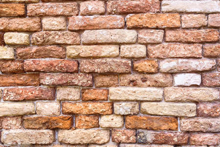 Colorful background of red grunge brick wall texture. Abstract wall texture.