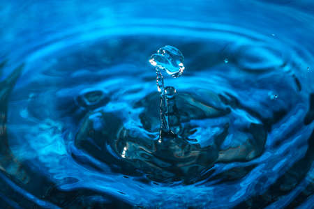 Water droplet on blue background. Amazing abstract water shot for texture. Nature conceptの写真素材