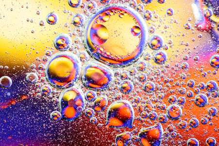 Colorful abstract background. Water drops rainbow colors on glass. Amazing abstract water drops on glass texture or backgroundの写真素材