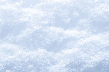 Snow surface texture background. Crystals and snowflakes. winter natural background