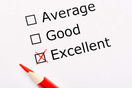 White paper sheet with checkboxes and red pencil. Survey asks the persons opinion whether it is...
