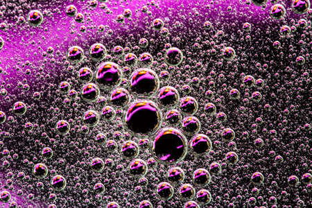 Abstract purple background with water bubbles. Macro shot of air or molecule. Cell, membrane texture backgroundの写真素材