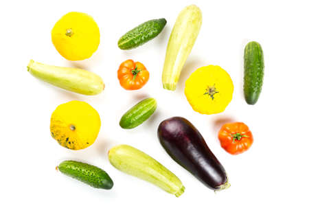 Vegetarian healthy food with vegetables. Tomato, cucumbers, bush pumpkin, eggplant and marrow isolated on white backgroundの写真素材