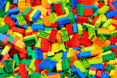 Plastic toy blocks erector set for children as a background. Selective focus.