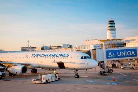 VIENNA, AUSTRIA - APRIL, 2017: The aircraft Turkish airlines rolls to the passenger tunnel after landing on Schwechat airport during sunset.のeditorial素材