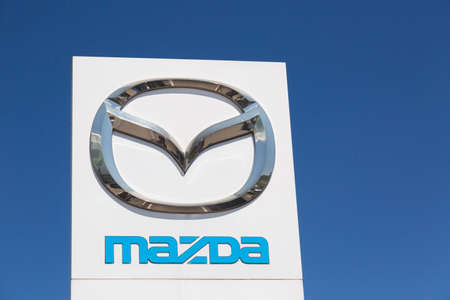 Moscow, Russia - May, 2018: Mazda automobile dealership Sign against blue sky. Mazda is a japanese manufacturer of automobiles and commercial vehiclesのeditorial素材