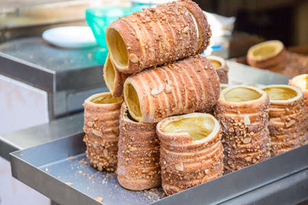 Trdelnik traditional Czech hot sweet pastry sold in the streets of Prague and another cities of Czech Republic. Czech cuisine and street foodの写真素材