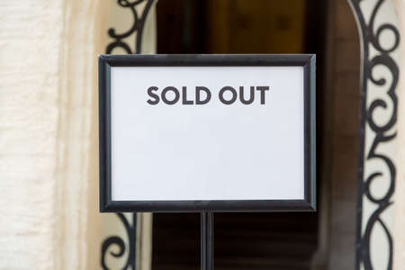 Sold out real estate or tickets sign before the entrance. Free space for your textの写真素材