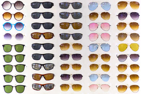 Colorful set of sunglasses for sale on white backgroundの写真素材