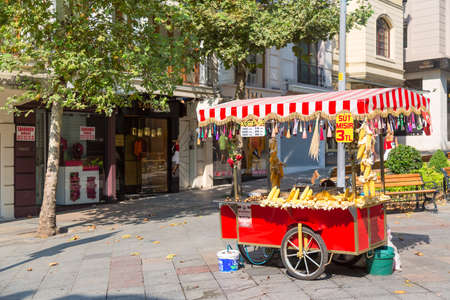Istanbul, Turkey - August, 2018: Istanbul street food. Red cart with roasted chestnuts and cornのeditorial素材