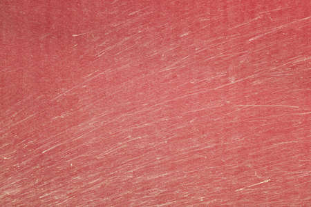 Fragment of dirty red car door as a backgroundの写真素材