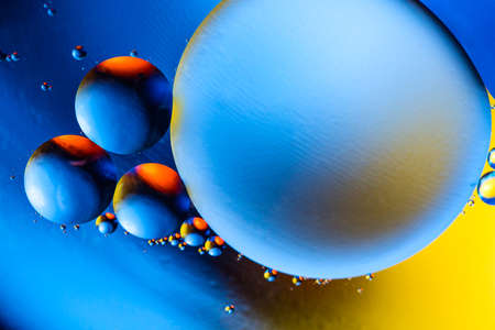 Abstract background with colorful gradient colors. Oil drops in water abstract psychedelic pattern...
