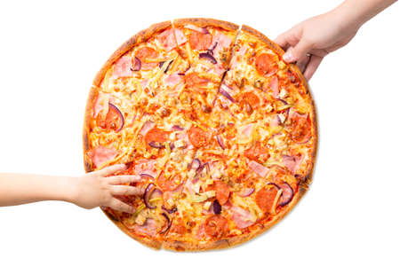 Female and childrens hands taking fresh and tasty pizza slices isolated on white backgroundの写真素材