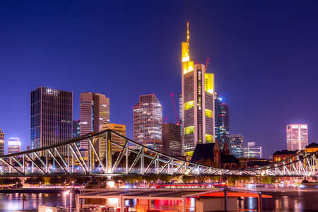 Skyline cityscape of Frankfurt, Germany during twilight evening with a bridge. Frankfurt Main in a financial capital of Europeの写真素材