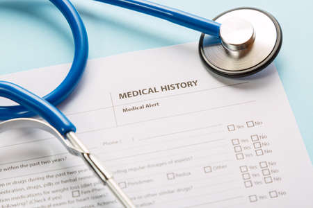 Stethoscope and patient medical history form. Health check diagnostics conceptの写真素材