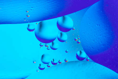 Abstract background with colorful blue gradient colors. Oil drops in water abstract psychedelic pattern imageの写真素材