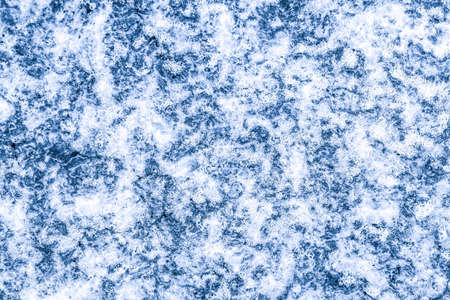 The texture of ice and frozen water. Winter background. Frosty natural ice and snowflake abstract...
