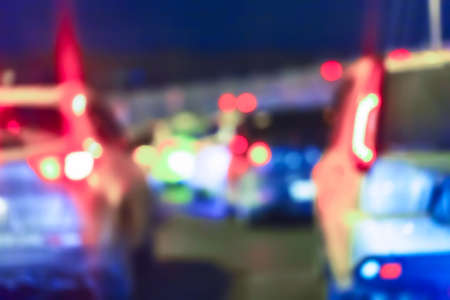 Blurred defocused abstract background of night city traffic jam with car lights. City abstract image.の写真素材