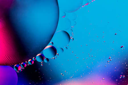 Abstract background with colorful gradient colors. Oil drops in water abstract psychedelic pattern...