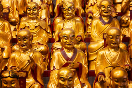 Gold statues of the Lohans in Longhua buddhist temple, Shanghai, Chinaの写真素材