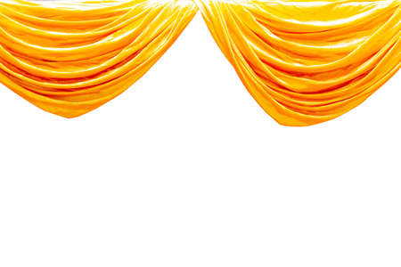Yellow stage theater curtain isolated on white backgroundの写真素材