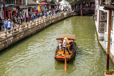 Shanghai, China - May, 2019: China traditional tourist boat on canal of Shanghai Zhujiajiao Old Town in Shanghai, China. Chinese Veniceのeditorial素材