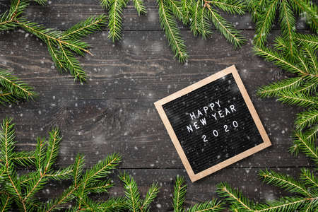 Christmas or new year frame for your project. Happy new year 2020 words on a letter board with...