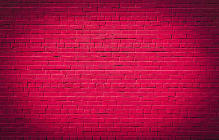 Pink brick wall texture background. Magenta colored brick wall texture architexture patternの写真素材