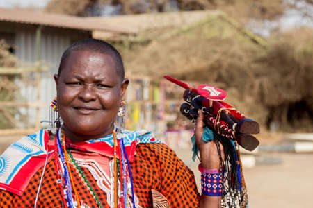 Amboseli, Kenya - August, 2019: The Masai woman portrait near entrance of Amboseli National Reserveのeditorial素材