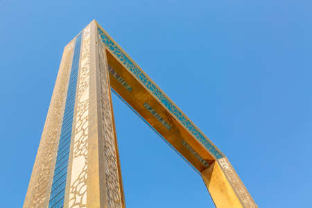 Dubai, United Arab Emirates - August, 2019: Golden Dubai Frame museum from below with clear blue sky in Zabeel Parkのeditorial素材