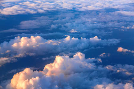 Beautiful above sky panoramic view from airplane. Skyline background panorama during sunset.の写真素材