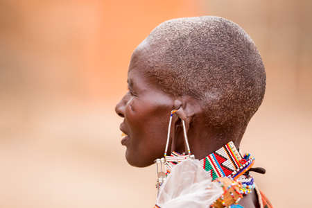 Masai Mara, Kenya - August, 2019: The Masai woman portrait near entrance of Masai Mara National Reserveのeditorial素材