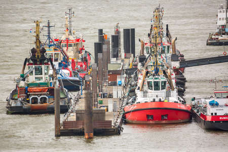 Hamburg, Germany - March, 2019: Ships in cargo port of Hamburg on the river Elbe, the largest port in Germanyのeditorial素材