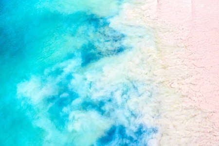 Top view aerial drone photo of ocean seashore with beautiful turquoise water and sea waves....