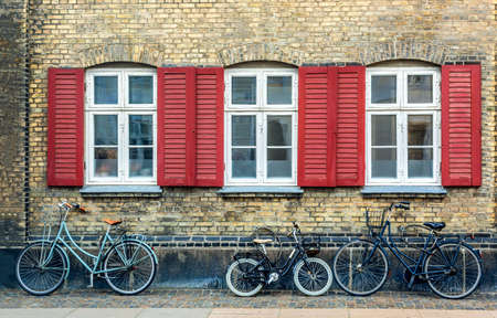 Old gray house in the center of Copenhagen with bicycles. Old Medieval district in Copenhagen, Denmark.の写真素材