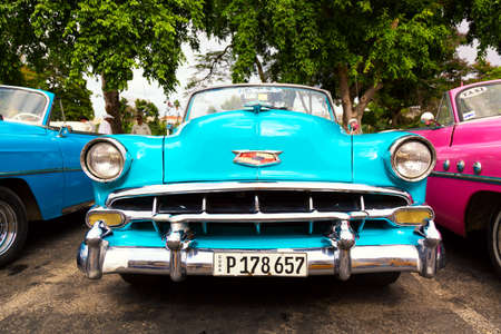 Havana, Cuba - November, 2018: Colorful vintage classic American cars parked on the street of Old Havana, Cubaのeditorial素材