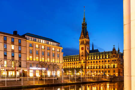 View of Hamburg townhall Rathaus and small Alster lake during twilight sunsetの写真素材