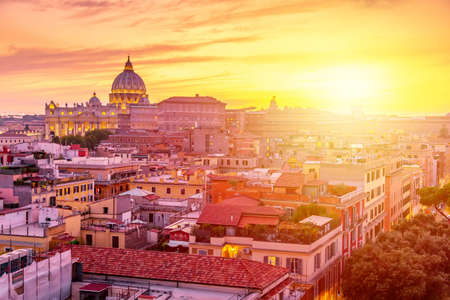 Cityscape view of Rome at sunset with St Peter Cathedral in Vaticanの写真素材