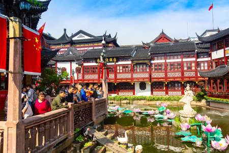 Shanghai, China - May, 2019: Beautiful woman sculpture in the pond of Yuyuan garden in old Shanghai, China. Summer sunny day.のeditorial素材