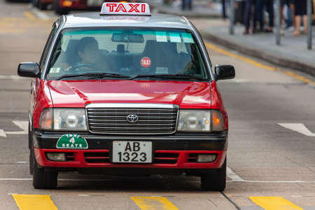 Hong Kong, SAR China - May, 2019: Typical Hong Kong red taxi car. Red Toyota Crown Comfort cars in a city street Nathan Roadのeditorial素材