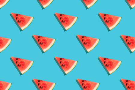Top view of watermelon slices on blue background. Watermelon colorful pattern.